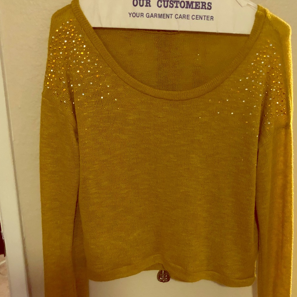 Little gold sweater with rhinestones.